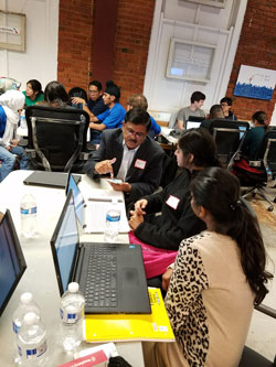 hacker team conversing at 2016 Dallas hackathon